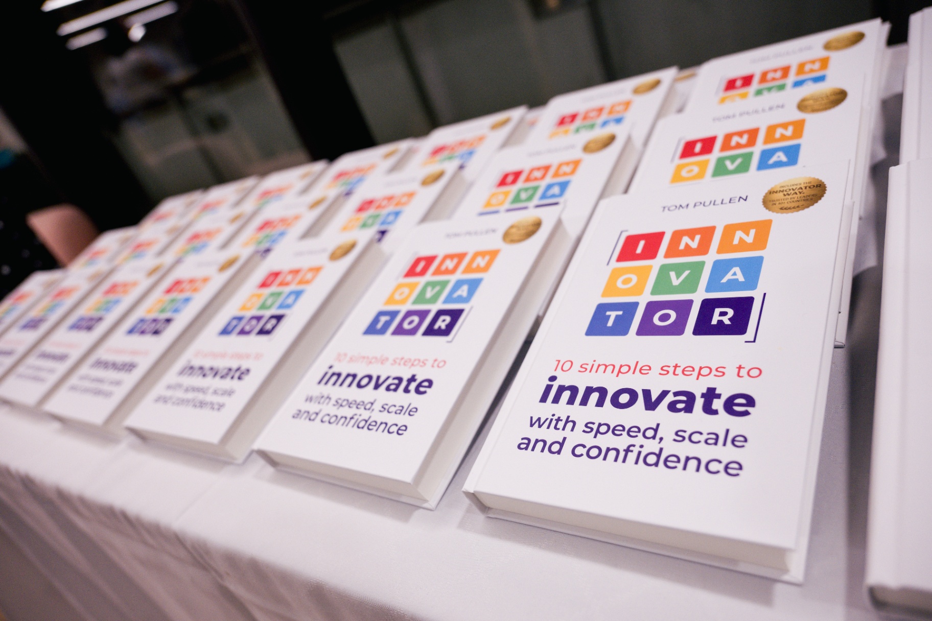 INNOVATOR books arranged on a table at the launch event