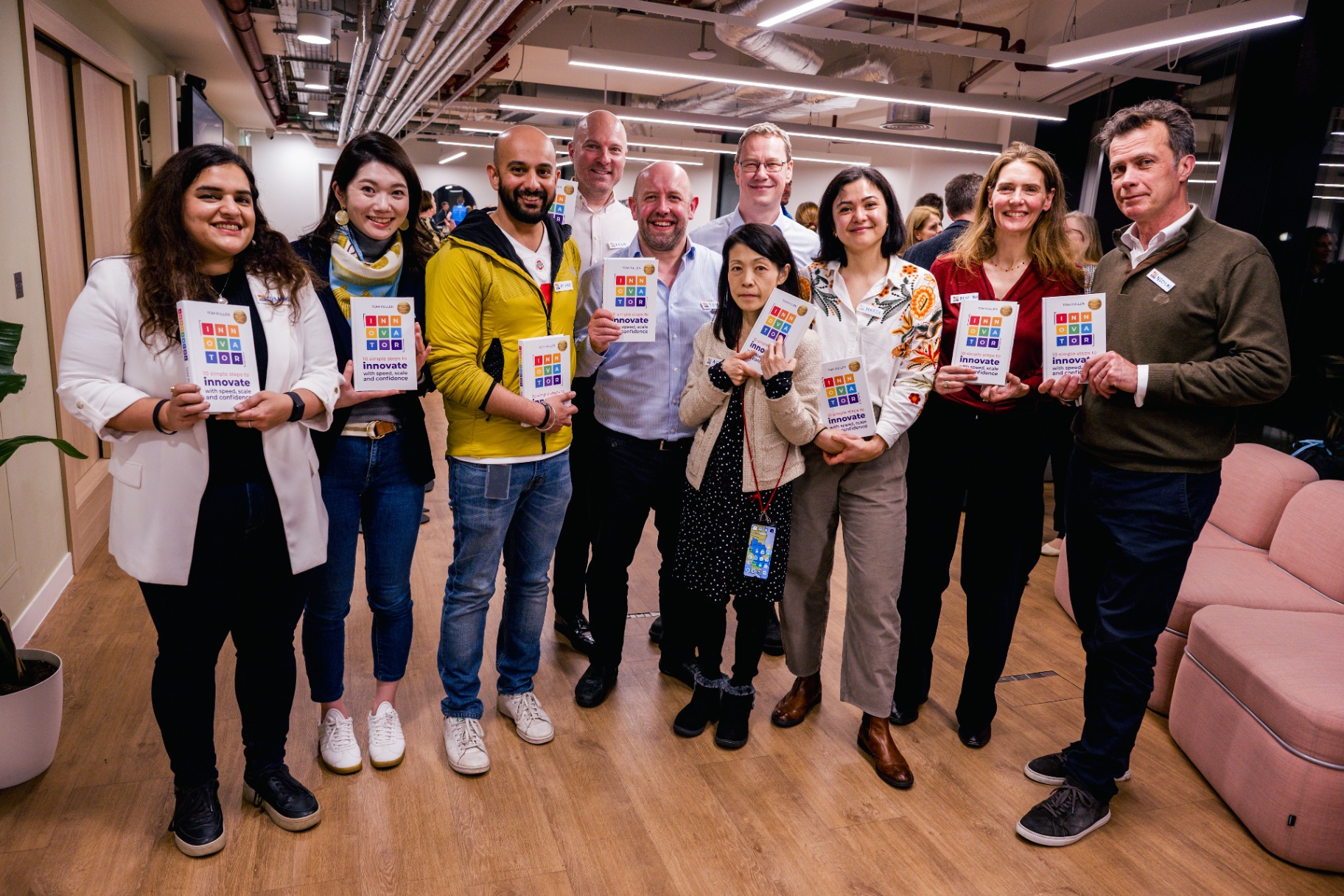 Readers holding copies of INNOVATOR at the launch